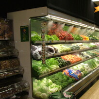 Fresh fruit and vegetables misted on supermarket shelf 2