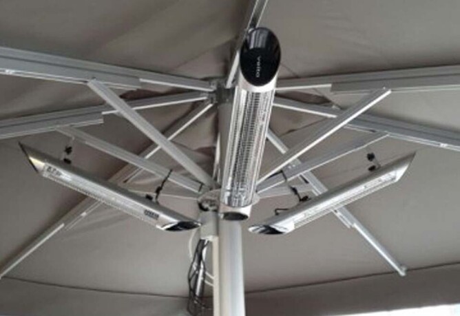 Veito infrared heaters installed under a market umbrella.