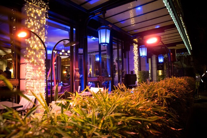 Stylish BellaSole freestanding double heaters provide restaurant guests warmth on cool evenings. 