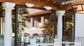 Outdoor dining in style and comfort with BellaSole wall heaters