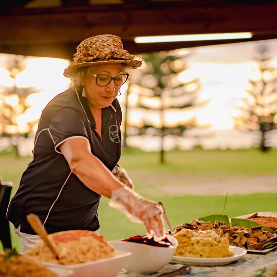 Woman preparing food outdoors