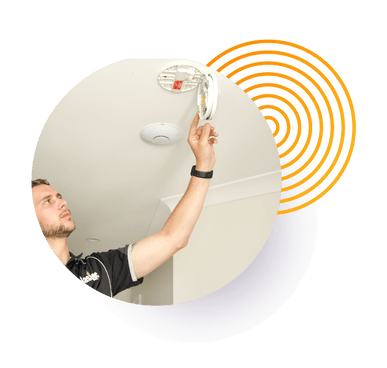 Smoke alarm being checked