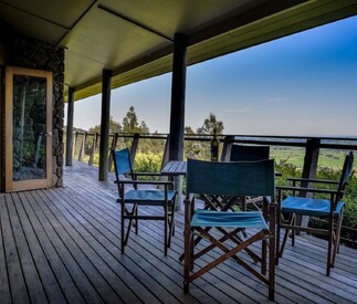 outdoor dining on deck with views below