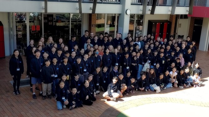 group of children most with the NSYO black hoodie