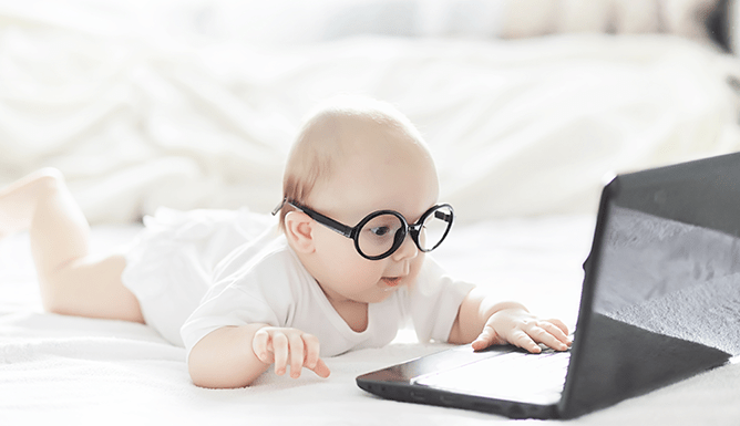 Bad data quality - image of baby in glasses at laptop