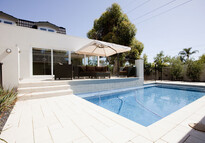 This stone paving around the pool works seamlessly with the new alfresco