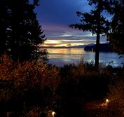 3D Model: View from South showing new beach house design in context with beach, slope and adjacent houses.