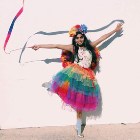Rainbow Fairy playing with Ribbon