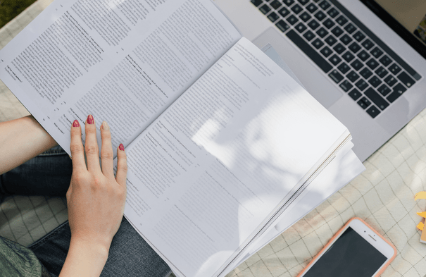 Image of university student with painted nails from nail salon