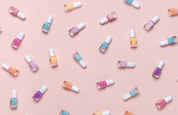 Image of coloured nail polish bottles at the nail salon