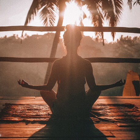 Woman silhouette meditating