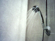 A picture of a shower and a link to the shower and accessories shop category