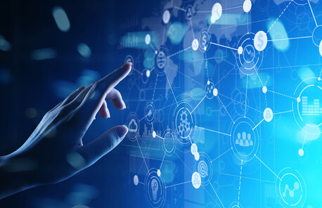 Hand reaching and touching a screen that shows diagnostics